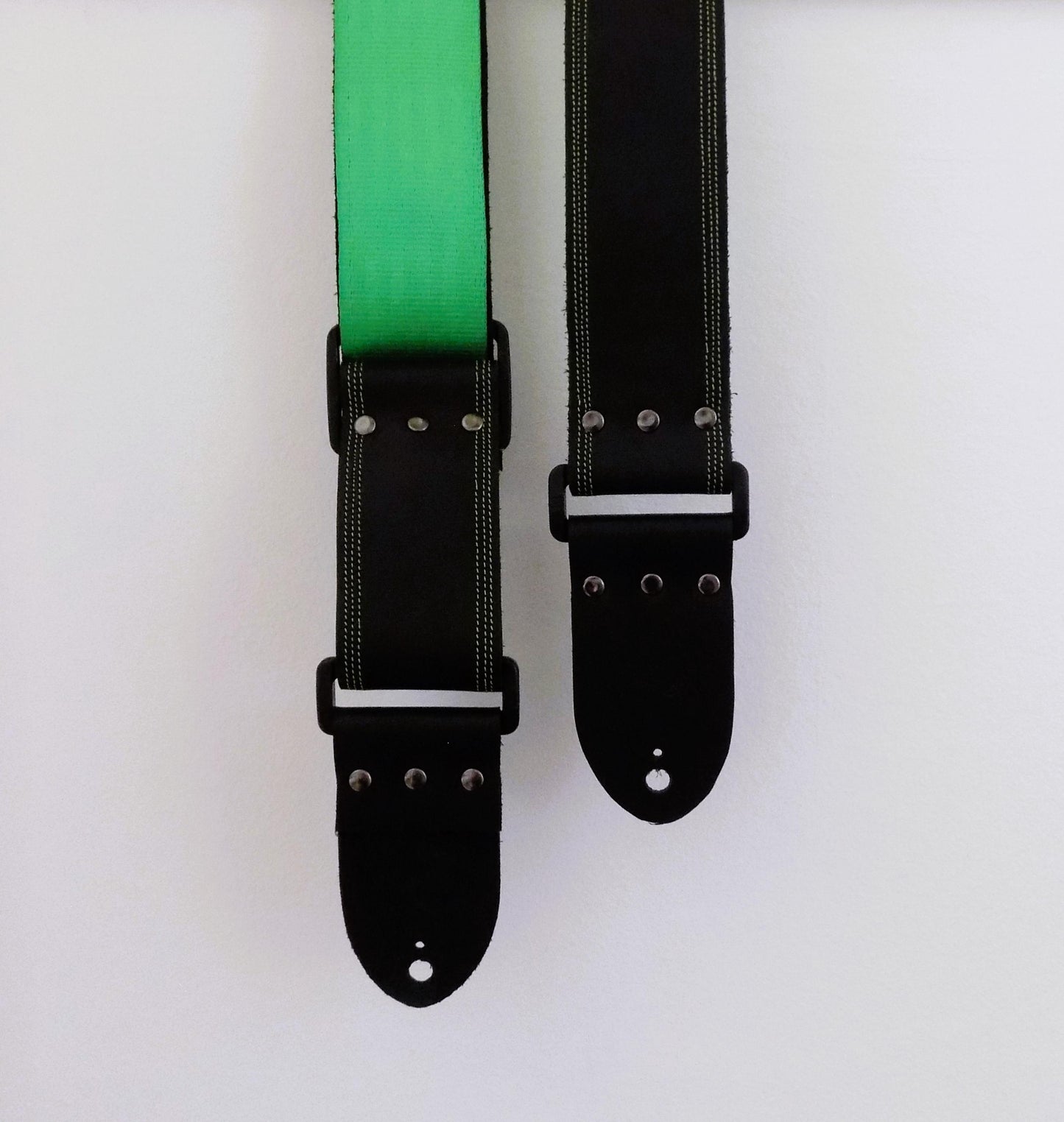 Handmade Black Full Leather Guitar Strap with seatbelt backing (different color options available) and matching threads to the front.