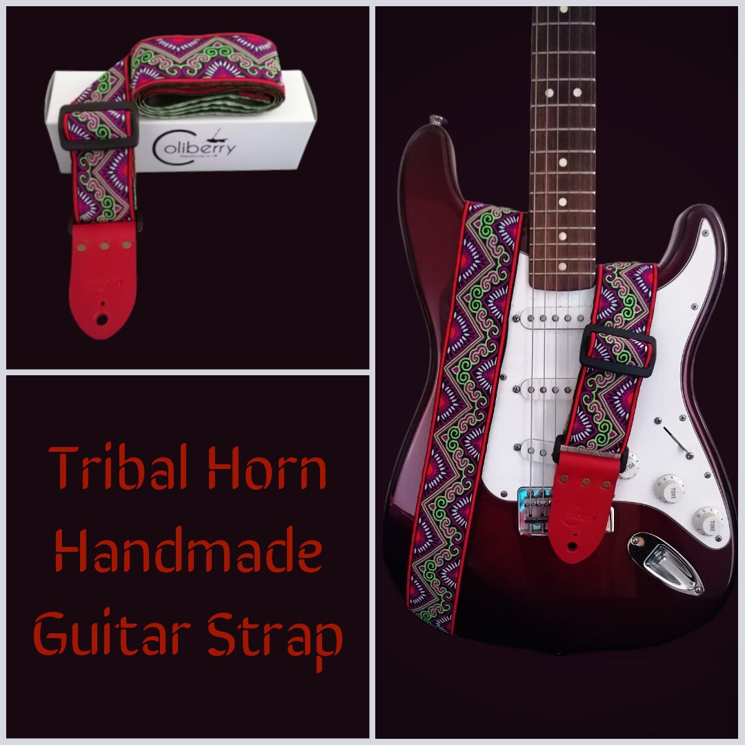 Handmade guitar strap - 'Red Tribal Horn' Red and Lime Jaquard Ribbon with Black Seatbelt backing and Antique Red Real Leather ends.