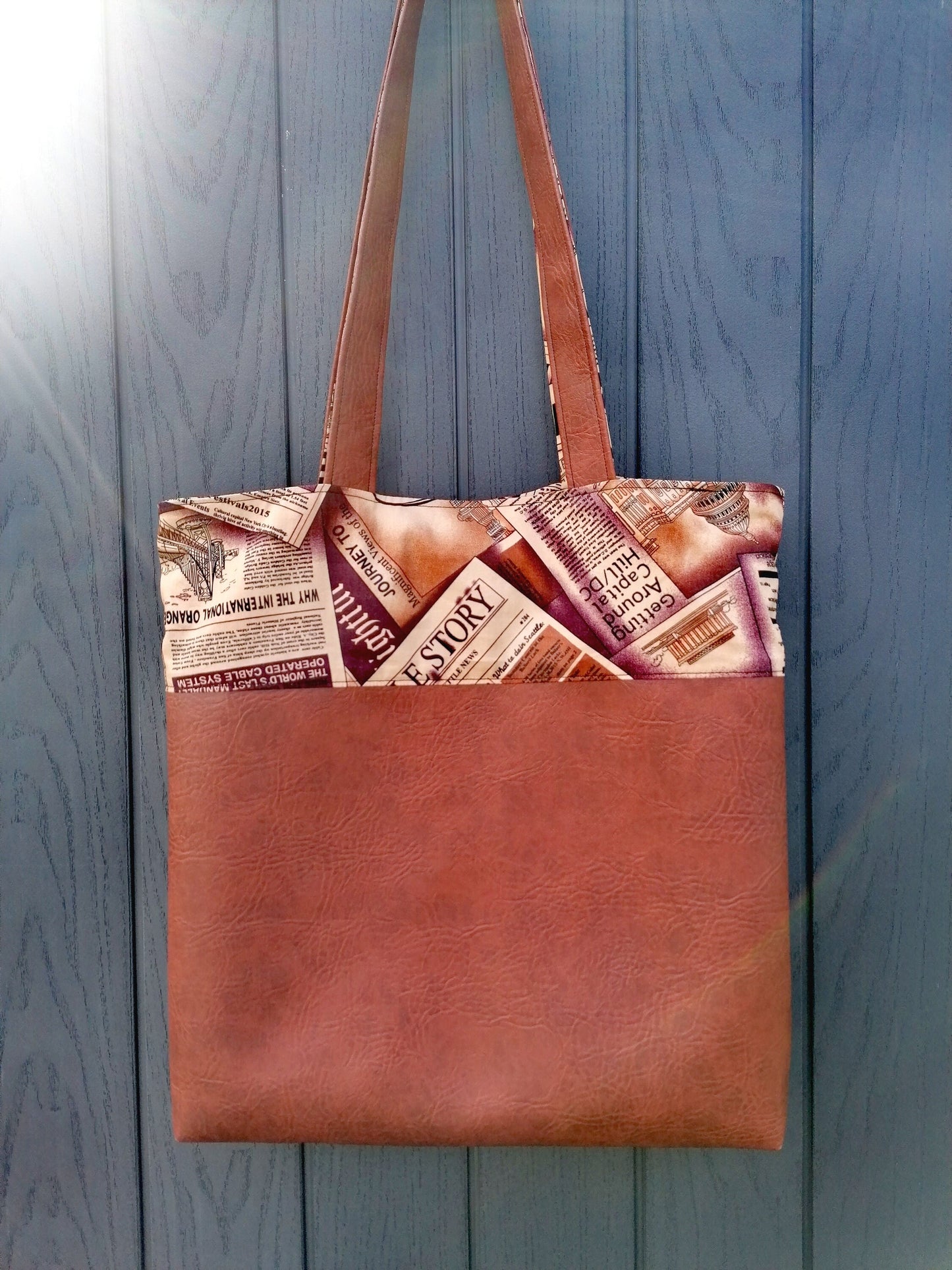 Handmade Reversible Tote Bags. Available in 2 colour options. Faux Leather (Brown or Green) and Cotton poplin with Newspaper pattern.