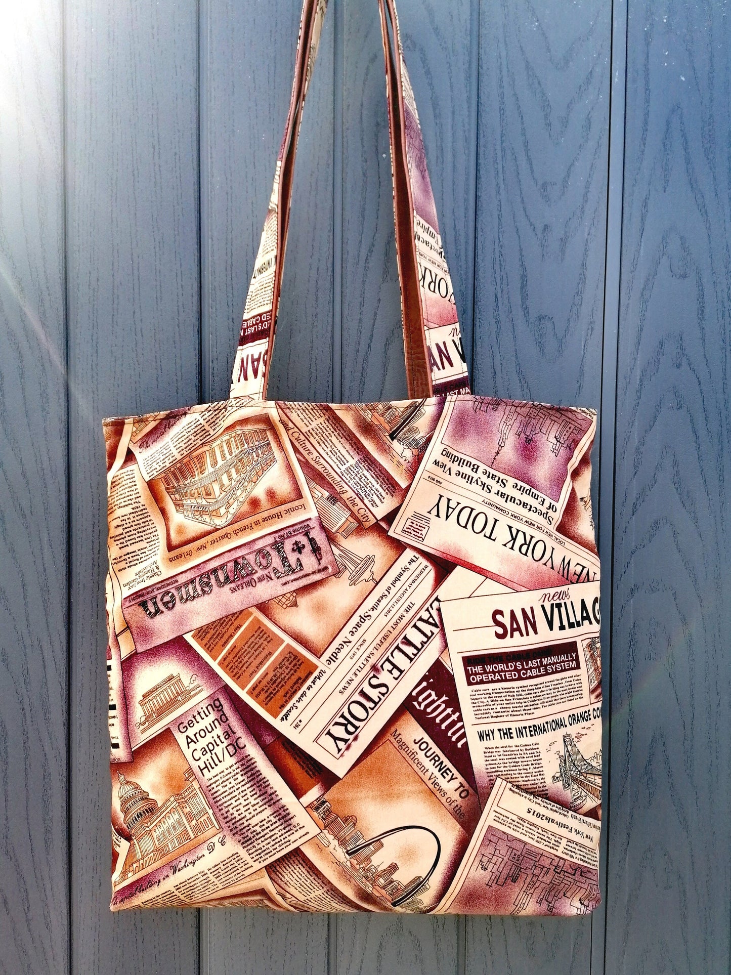 Handmade Reversible Tote Bags. Available in 2 colour options. Faux Leather (Brown or Green) and Cotton poplin with Newspaper pattern.