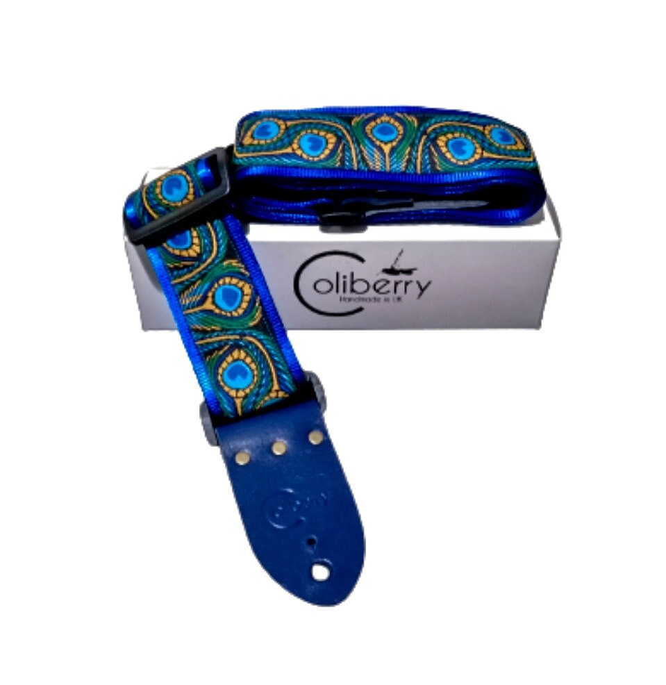 Handmade guitar strap - Blue Peacock pattern to the front with Royal Blue Seatbelt backing and Midnight Blue colour Real Leather ends