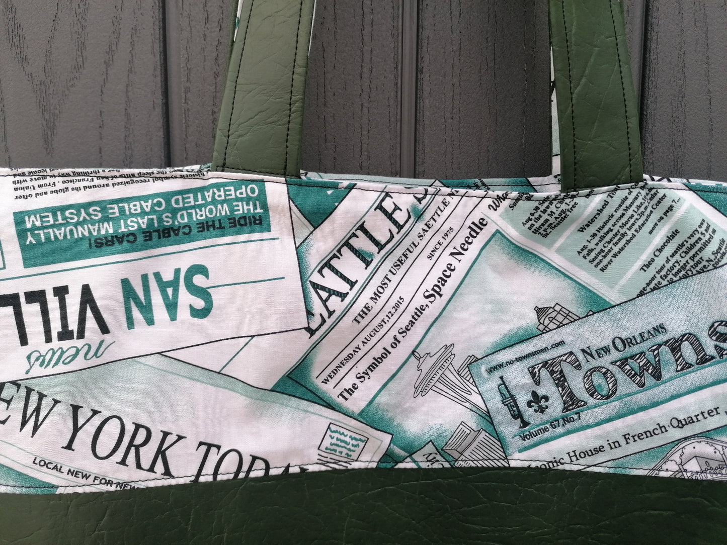Handmade Reversible Tote Bags. Available in 2 colour options. Faux Leather (Brown or Green) and Cotton poplin with Newspaper pattern.