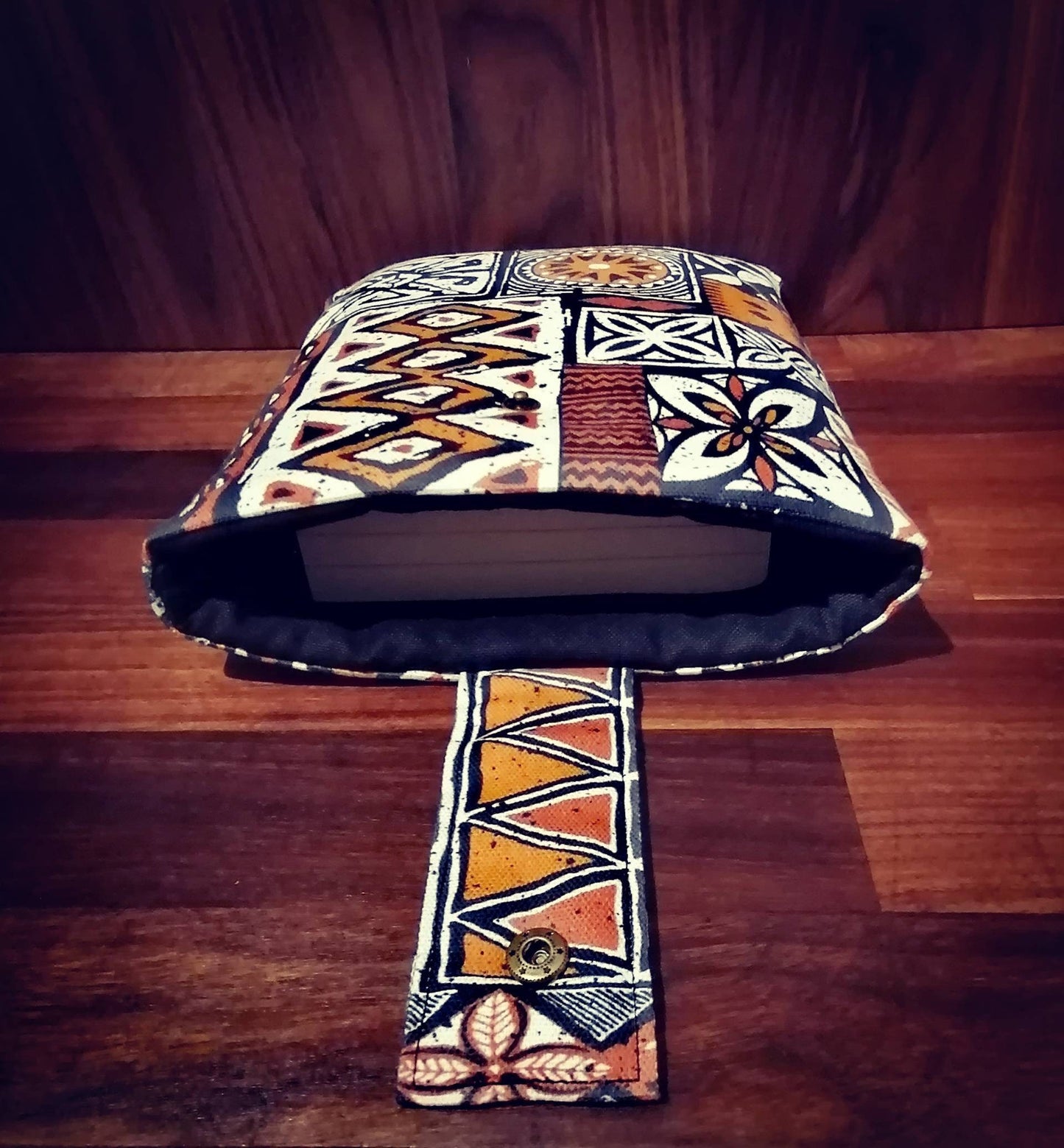 Handmade padded book sleeve/Tablet Covers, available in 2 funky patterns with snap on strap to the top.