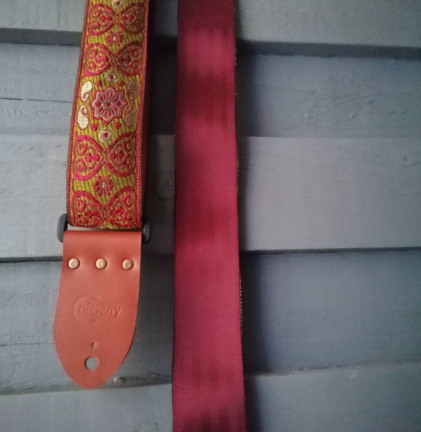 Handmade guitar straps with Baroque pattern Jaquard ribbon to the front and seatbelt backing finished with real leather ends.