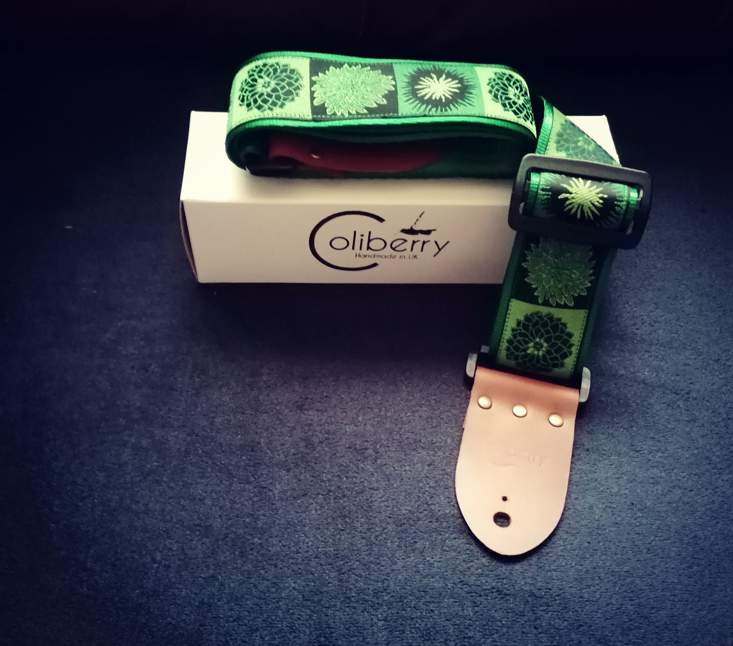 Handmade guitar strap. Flower Power available in 3 colours (Purple, Green, Red) with Seatbelt backing and Montana Hazelnut Real Leather ends