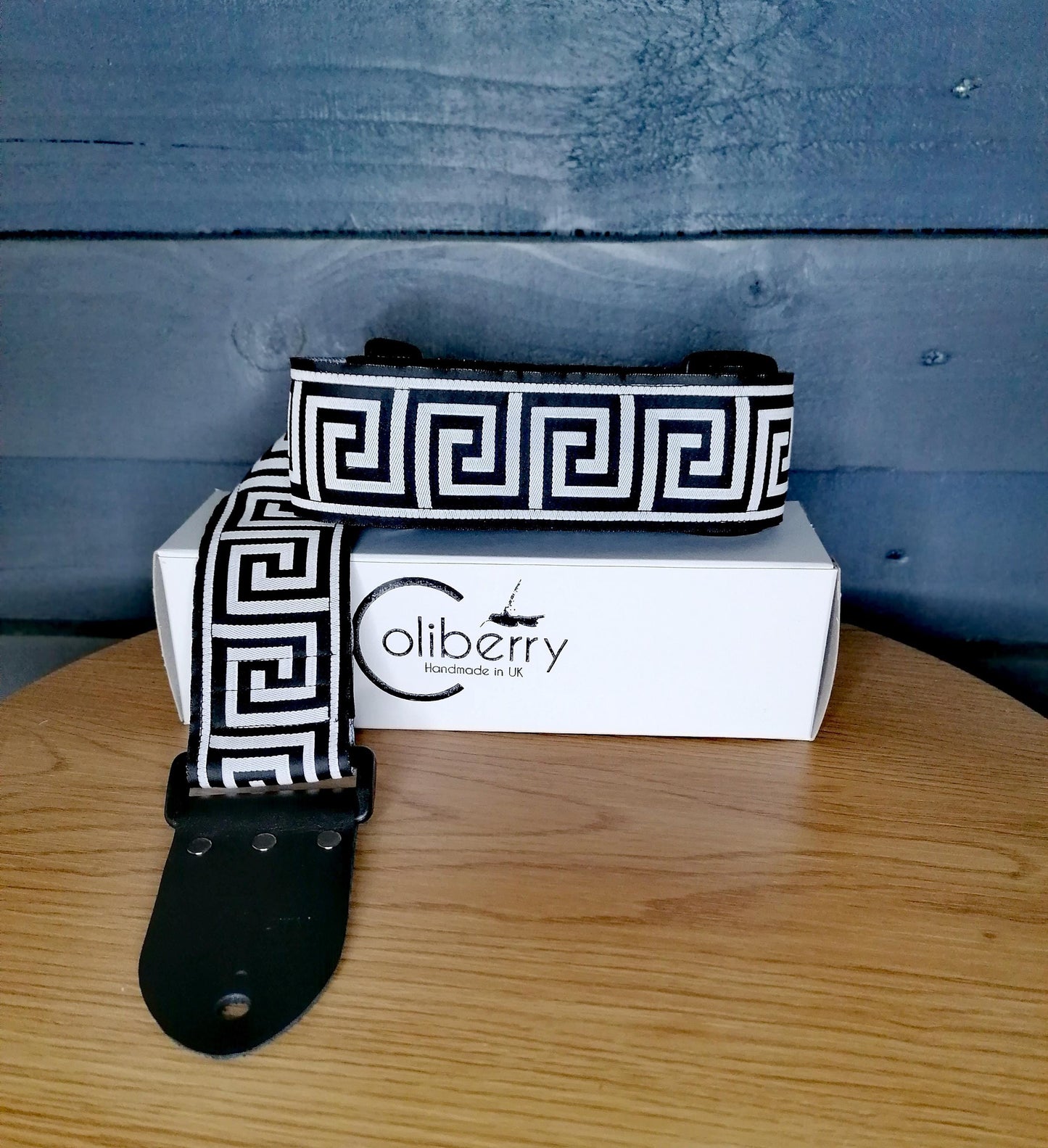 Handmade guitar strap - Greek Key Mono pattern to the front with Black Seatbelt backing and Montana Black Real Leather ends.