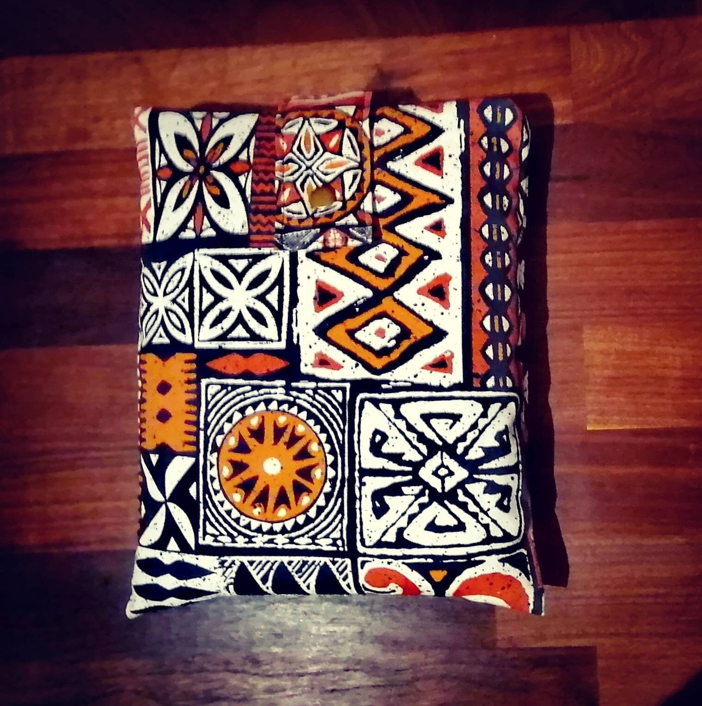 Handmade padded book sleeve/Tablet Covers, available in 2 funky patterns with snap on strap to the top.
