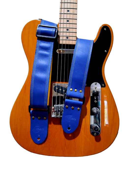 Blue Full Leather Guitar Strap with yellow seatbelt backing.