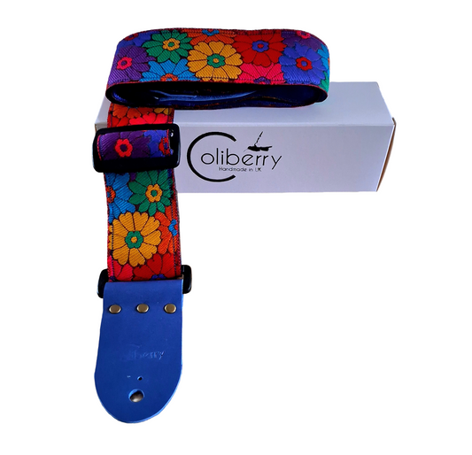 'Rainbow Meadow' Handmade Guitar Strap with blue seatbelt backing and blue real leather ends.