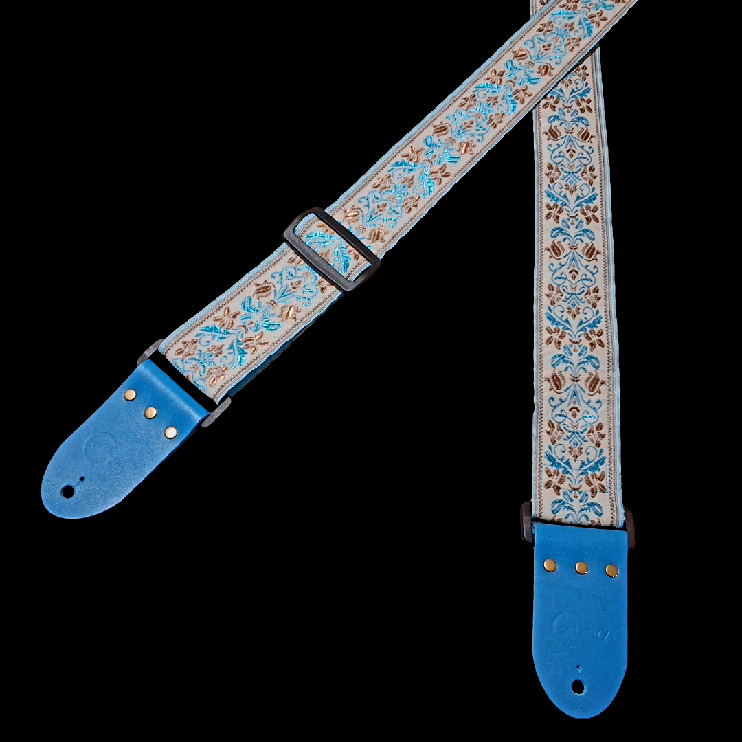 Handmade 'San Marino' guitar strap with Kingfisher Blue real leather ends. Adjustable.