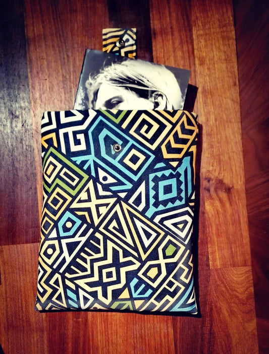 Handmade padded book sleeve/Tablet Covers, available in 2 funky patterns with snap on strap to the top.