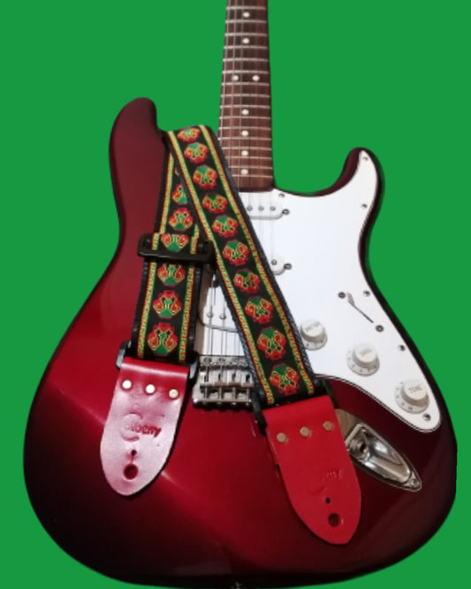 Handmade guitar strap - 'CYBER SKULL' pattern to the front with Black Seatbelt backing and Red Real Leather ends.