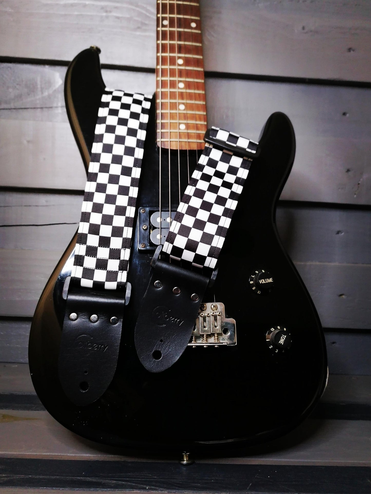 Handmade guitar strap -  Black&White Chequered pattern to the front with Black Seatbelt backing and Montana Black colour Real Leather end
