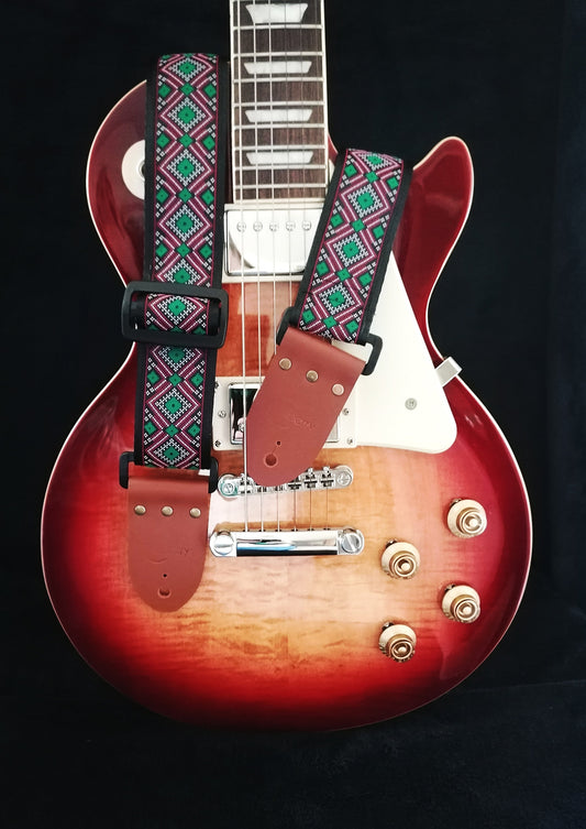 Handmade guitar strap - Diamond Dots pattern to the front with Black Seatbelt backing and Montana Hazelnut colour Real Leather ends.