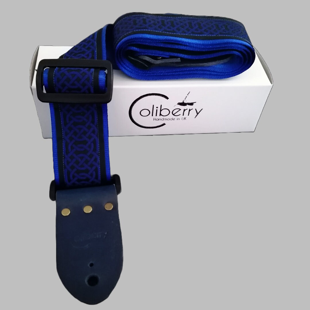Handmade guitar strap - Blue Celtic pattern to the front with Royal Blue Seatbelt backing and Midnight Blue colour Real Leather ends.