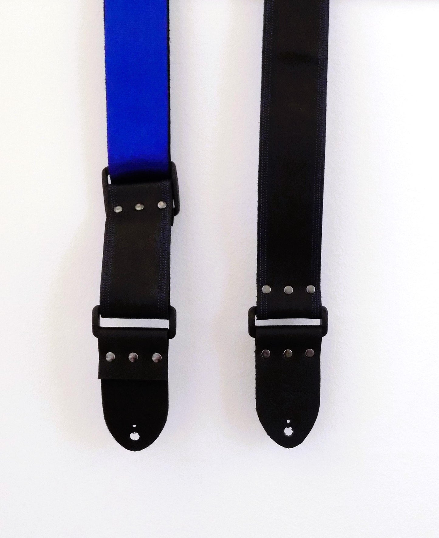 Handmade Black Full Leather Guitar Strap with seatbelt backing (different color options available) and matching threads to the front.