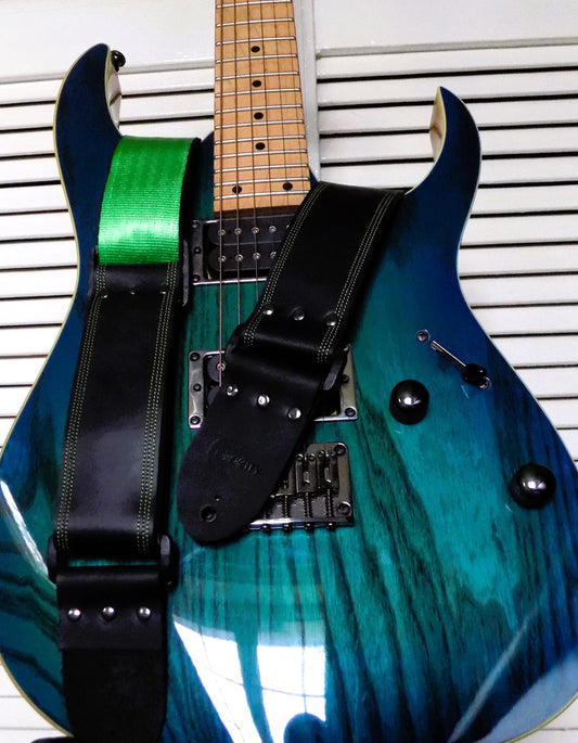 Handmade Black Full Leather Guitar Strap with seatbelt backing (different color options available) and matching threads to the front.