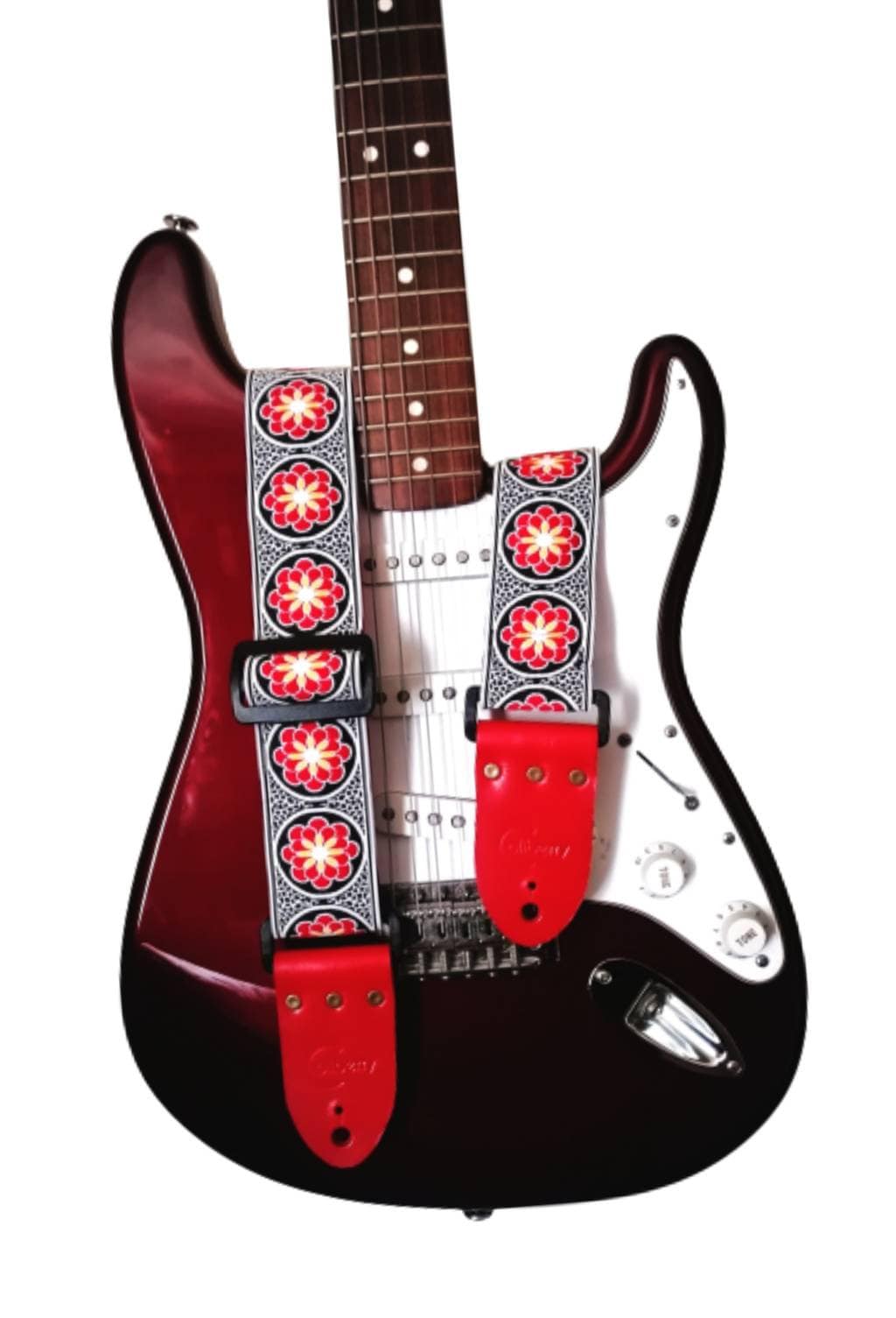 Handmade guitar strap. Red and Black embroidered flower Ribbon with Red Seatbelt backing and Red Leather ends.