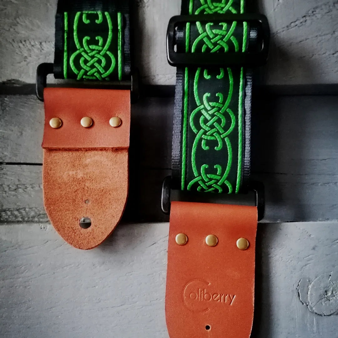Handmade guitar strap 'Green Celtic Chain' Jaquard Ribbon on front with Black Seatbelt backing and Montana Hazelnut colour Real Leather ends