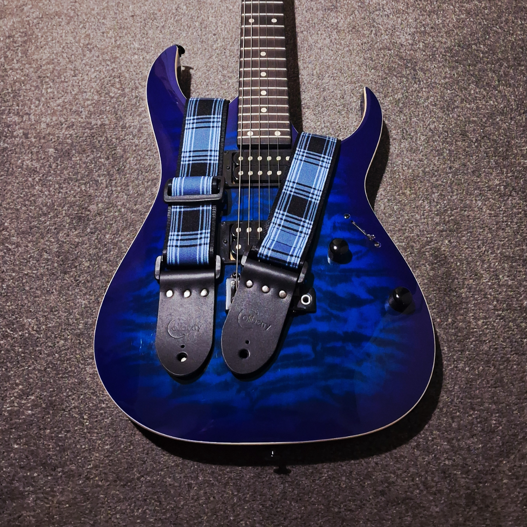 Handmade 'Tartan Blue' guitar strap with Montana Black leather ends. Adjustable.