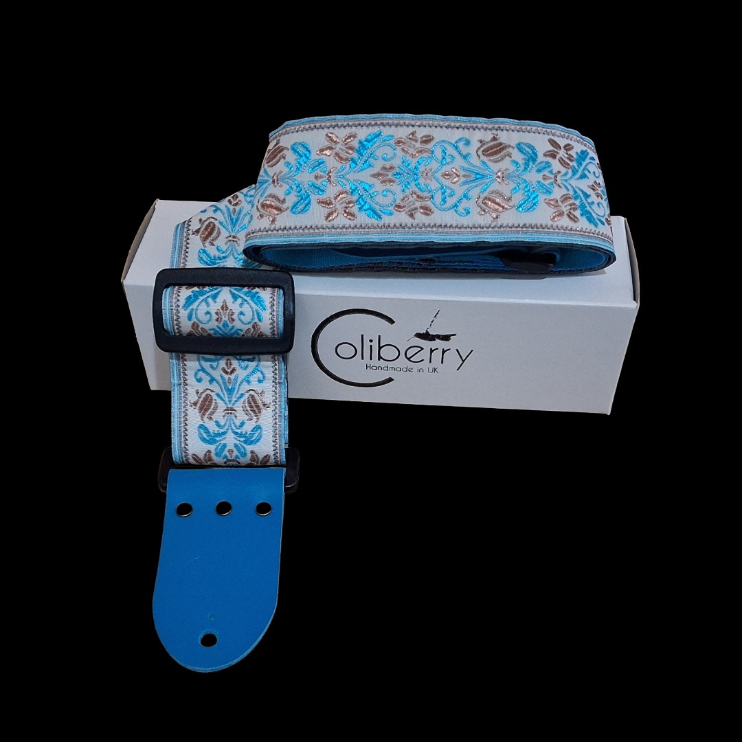 Handmade 'San Marino' guitar strap with Kingfisher Blue real leather ends. Adjustable.