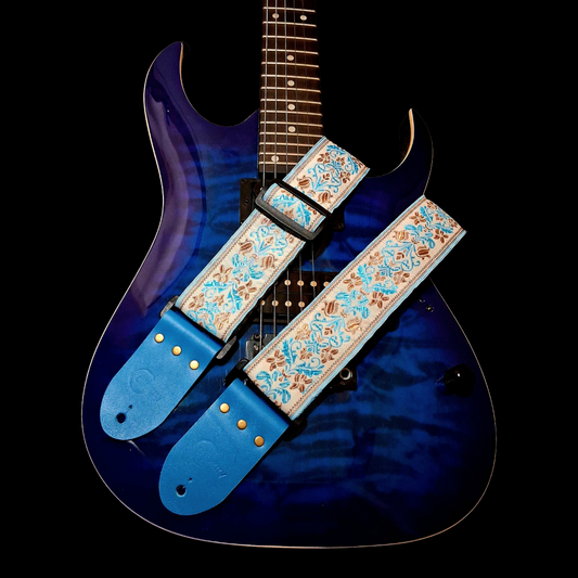 Handmade 'San Marino' guitar strap with Kingfisher Blue real leather ends. Adjustable.