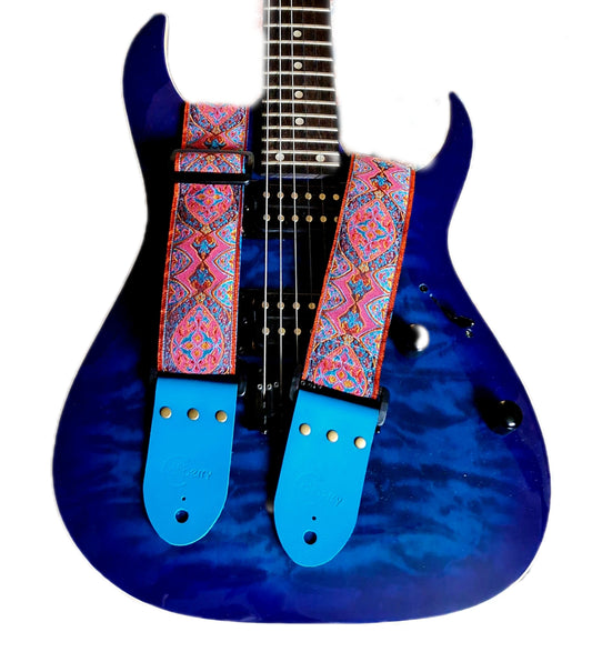 Handmade 'Pink Sunbeam' guitar strap with Kingfisher Blue real leather ends.