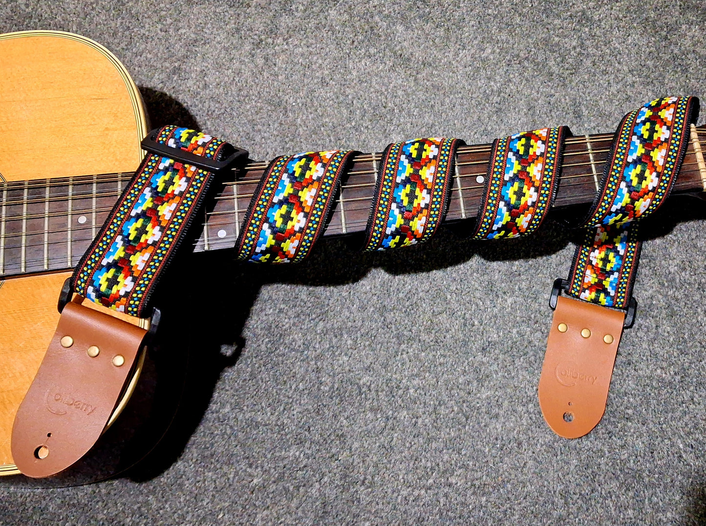 Handmade Cancun Guitar Strap: Aztec multicolour pattern Jacquard Ribbon and Leather Ends.