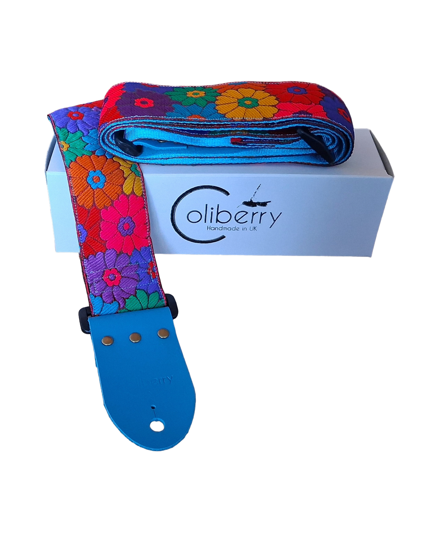 'Rainbow Meadow' Handmade Guitar Strap with blue seatbelt backing and blue real leather ends.