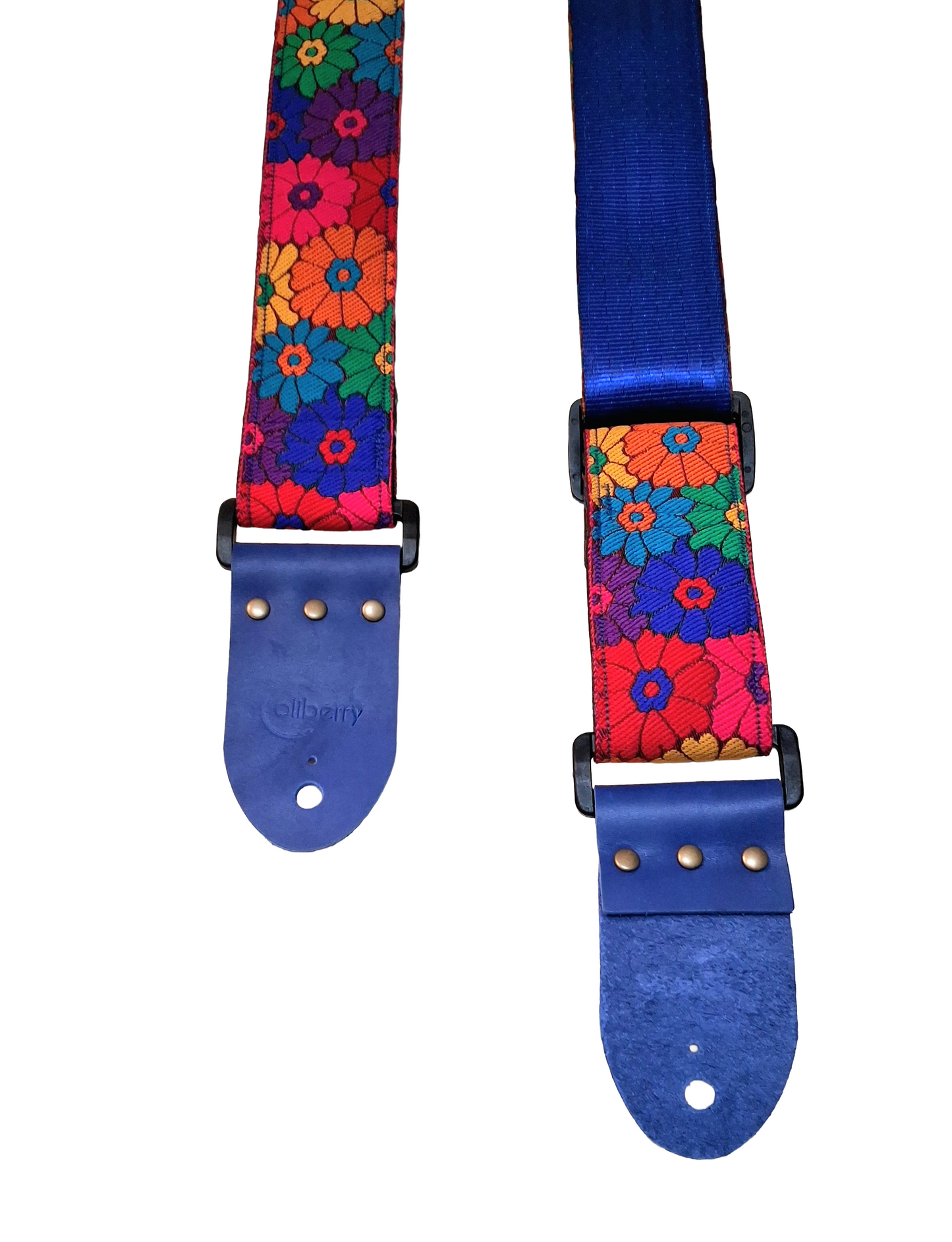 'Rainbow Meadow' Handmade Guitar Strap with blue seatbelt backing and blue real leather ends.