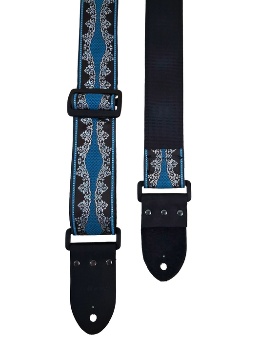 Handmade guitar strap - 'Venecia' Turquoise, Black and Silver with Black Seatbelt backing and Montana Black Real Leather ends.